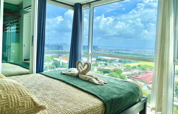 Stunning view staycation near MOA PICC WORLD TRADE CENTER AIRPORT LUNETA PARK MANILA OCEAN PARK QURINO GRANDSTAND, Rezervasyon   